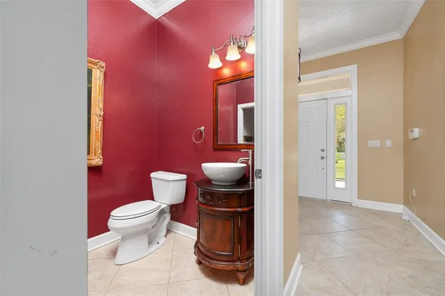a bathroom with a sink a vanity and a mirror