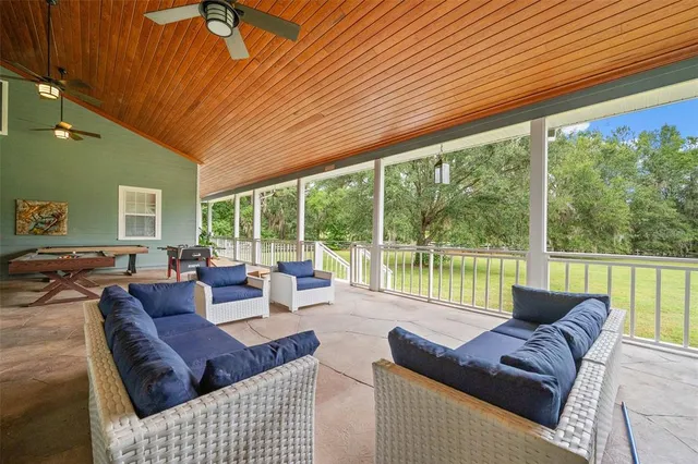 a spacious bathroom with a tub shower and a sink