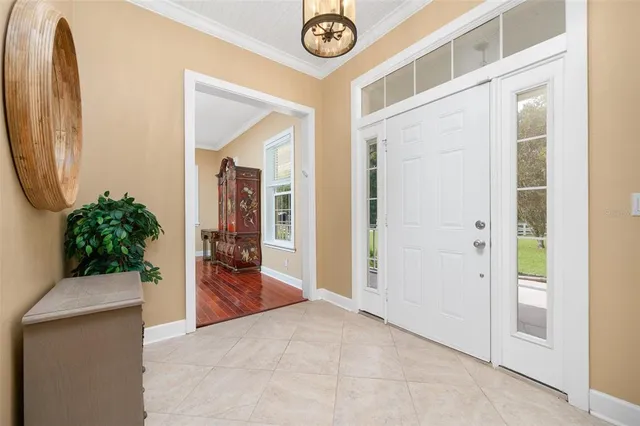 a living room with furniture gym equipment and a fireplace