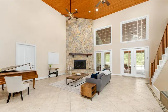 a kitchen with stainless steel appliances granite countertop sink stove and refrigerator