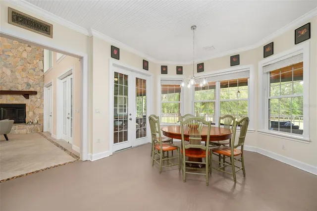a kitchen with stainless steel appliances granite countertop a sink a stove and cabinets
