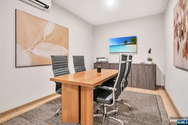 a dining room with a table and chairs
