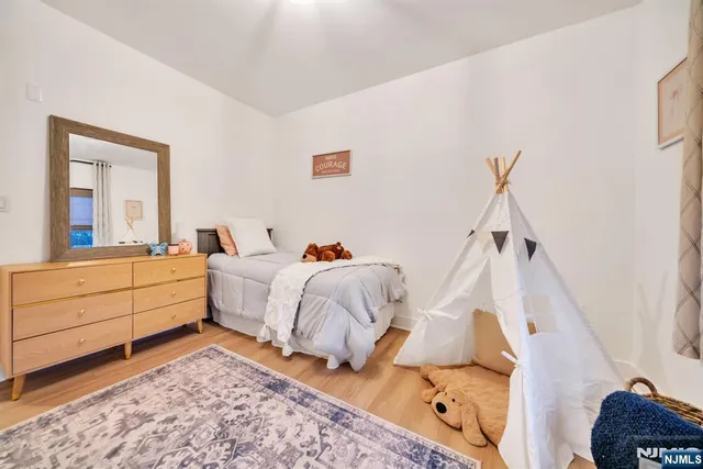 a bed room with a bed and a window