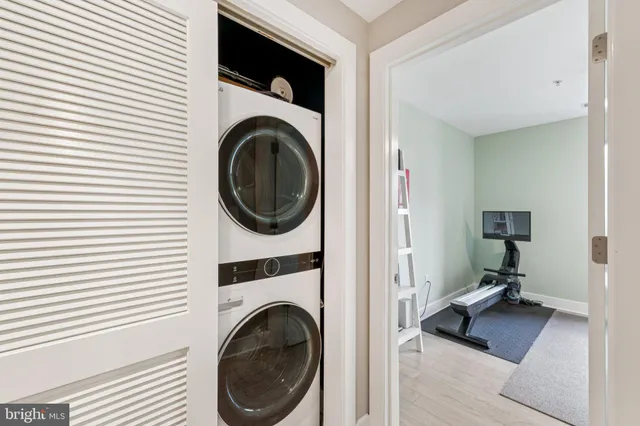 a view of a hallway with washer and dryer