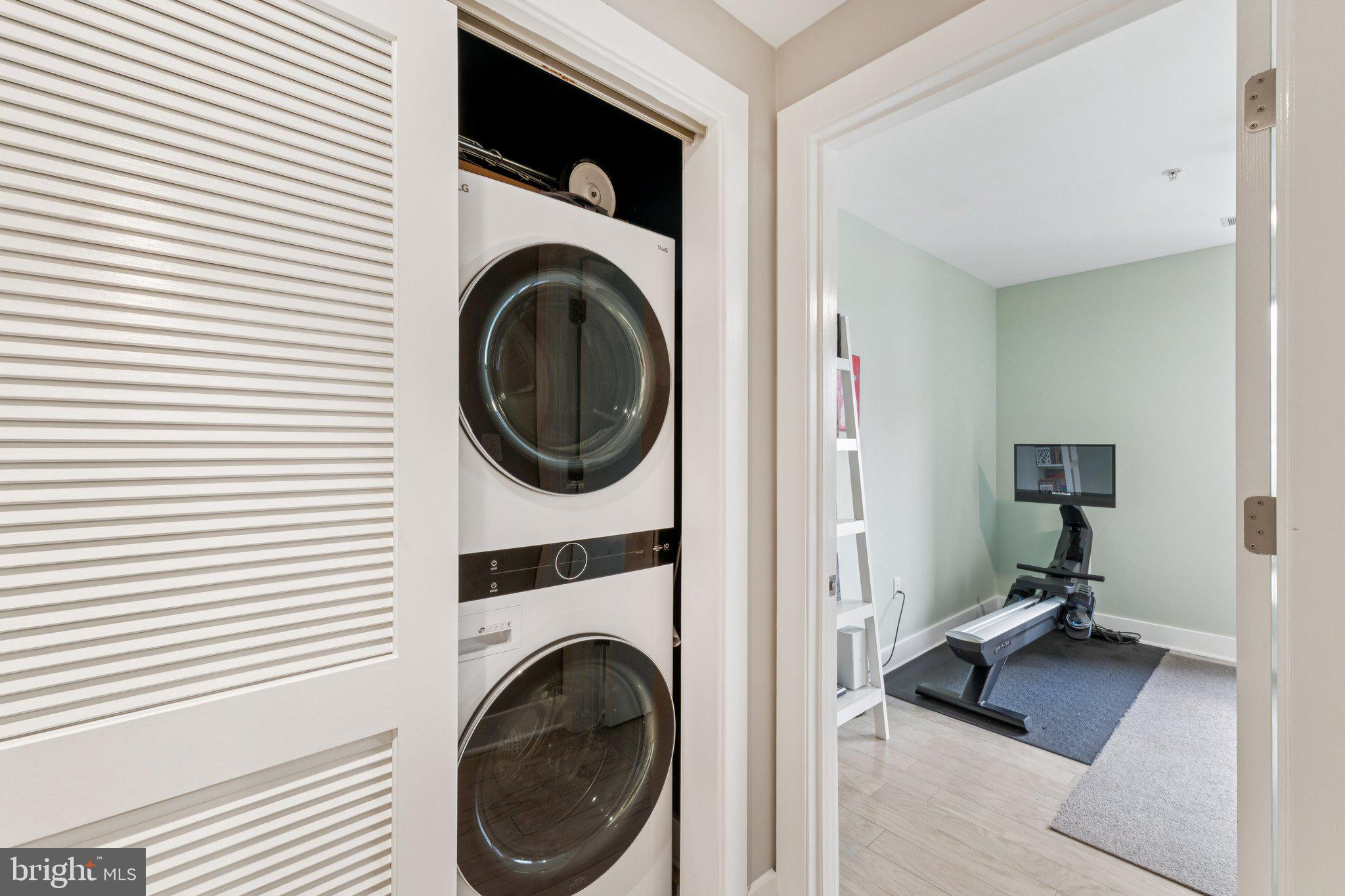 1634 14th Street Northwest, Unit 201 Washington, DC 20009 - Photo 18 of 21 a view of a hallway with washer and dryer