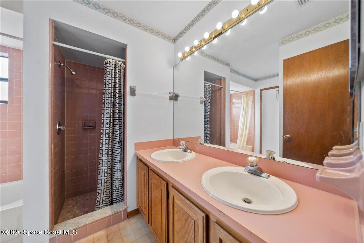 846 Gardener Road Rockledge, FL 32955 - Photo 18 of 27 a bathroom with a sink and mirror