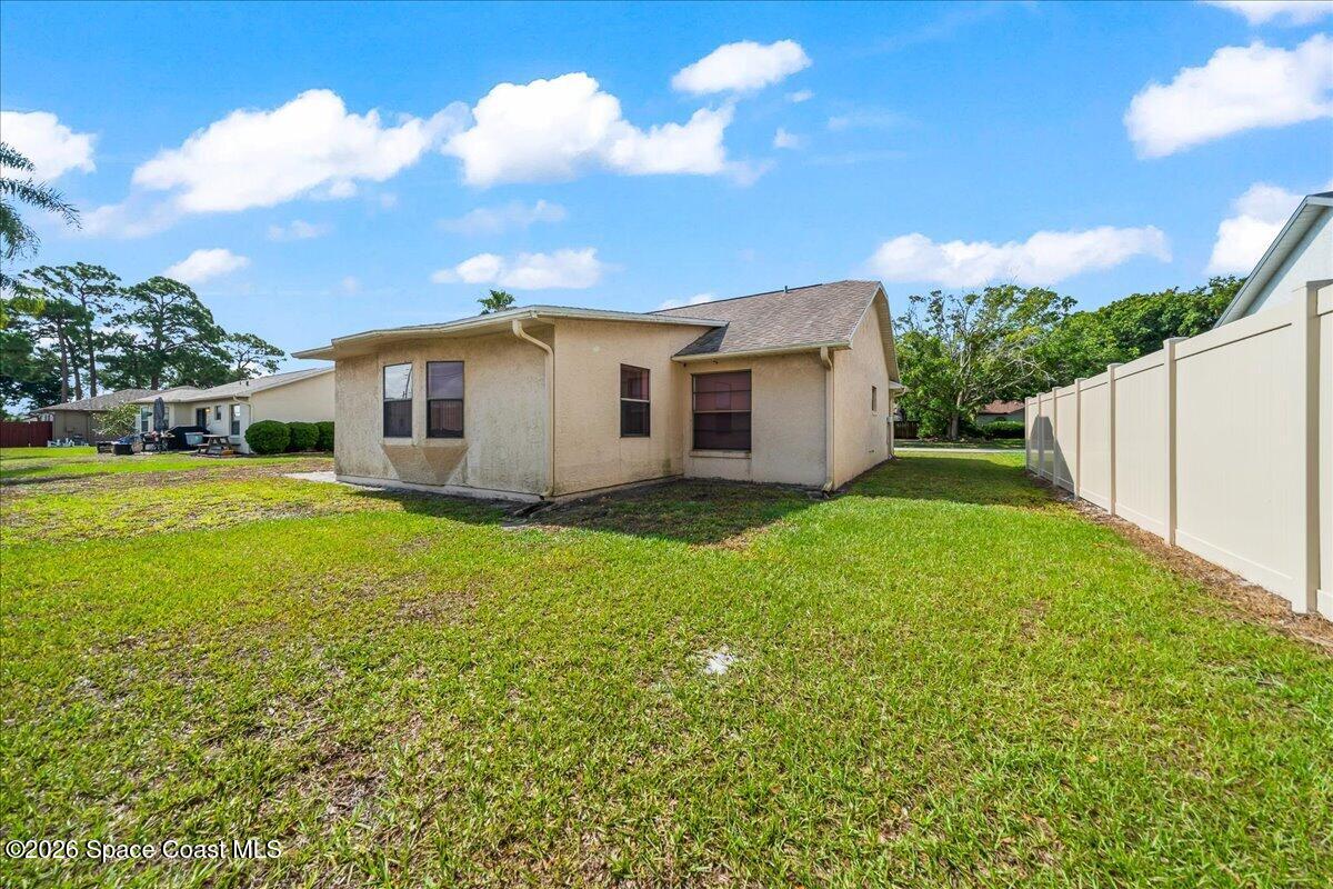 846 Gardener Road Rockledge, FL 32955 - Photo 26 of 27 a view of a house with a yard
