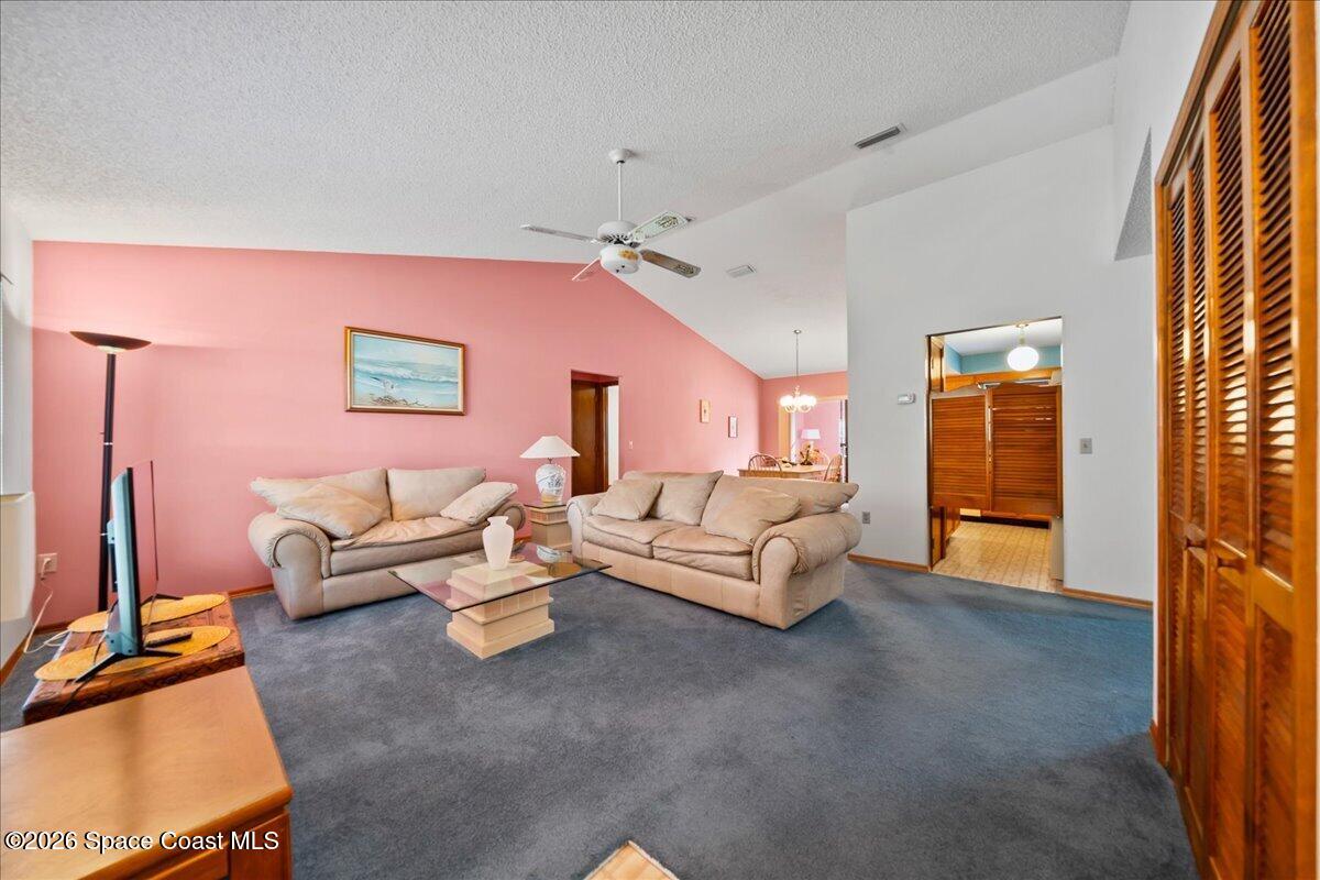 846 Gardener Road Rockledge, FL 32955 - Photo 5 of 27 a living room with furniture and a flat screen tv
