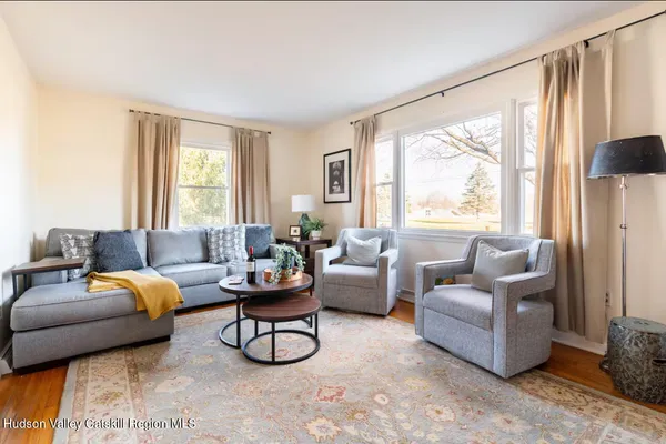 a living room with furniture and a large window