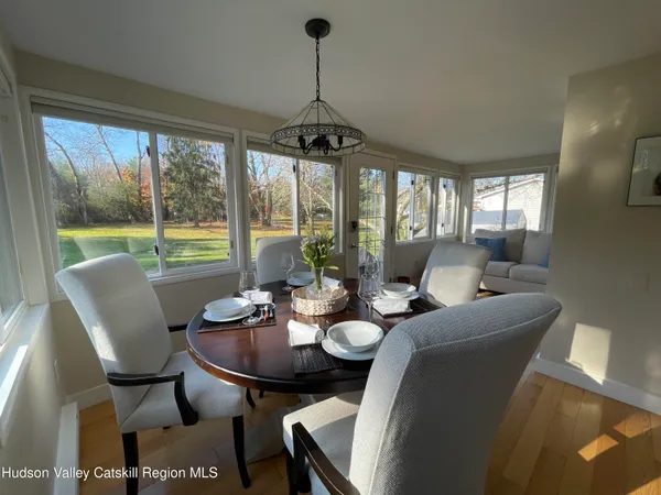 a view of a dining room with furniture window and outside view