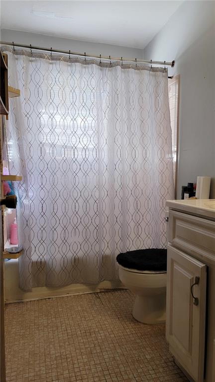 234 Howell Terrace Southwest Atlanta, GA 30331 - Photo 12 of 64 a bathroom with a shower curtain and a sink