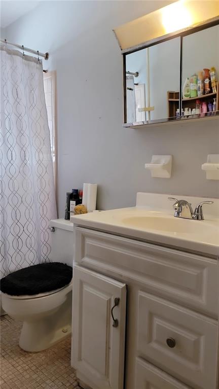 234 Howell Terrace Southwest Atlanta, GA 30331 - Photo 14 of 64 a bathroom with a sink and a toilet