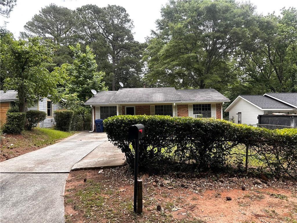 234 Howell Terrace Southwest Atlanta, GA 30331 - Photo 2 of 64 a front view of a house with garden