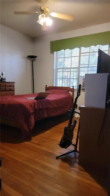 234 Howell Terrace Southwest Atlanta, GA 30331 - Photo 22 of 64 a bed room with a bed and a chair