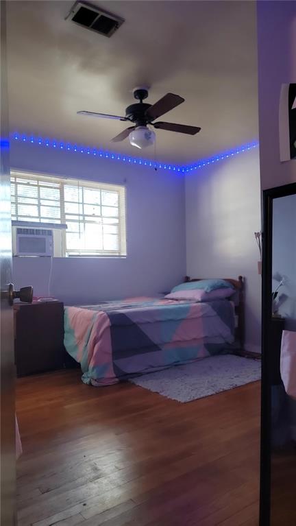 234 Howell Terrace Southwest Atlanta, GA 30331 - Photo 25 of 64 a bedroom with a bed and wooden floor