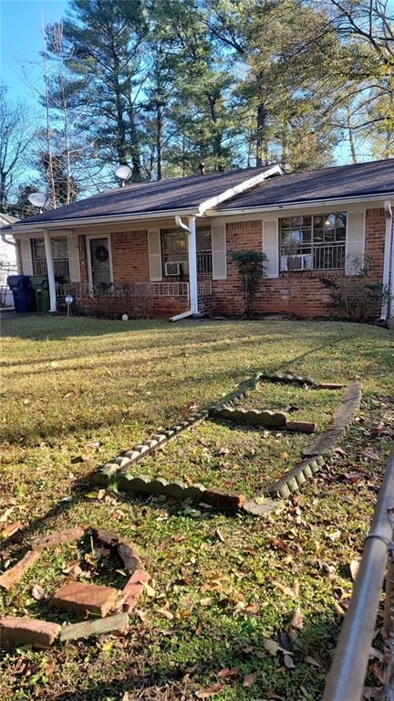 234 Howell Terrace Southwest Atlanta, GA 30331 - Photo 3 of 64 a front view of a house with a garden