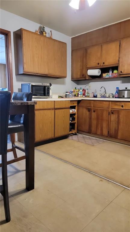 234 Howell Terrace Southwest Atlanta, GA 30331 - Photo 34 of 64 a kitchen with stainless steel appliances granite countertop a stove a sink and a refrigerator