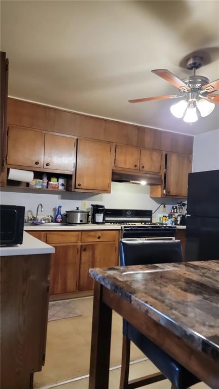 234 Howell Terrace Southwest Atlanta, GA 30331 - Photo 35 of 64 a kitchen with stainless steel appliances granite countertop a sink counter space and cabinets