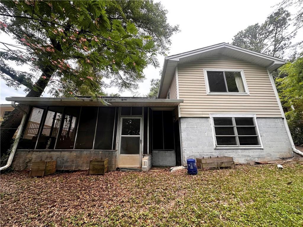 234 Howell Terrace Southwest Atlanta, GA 30331 - Photo 60 of 64 a house with trees in the background