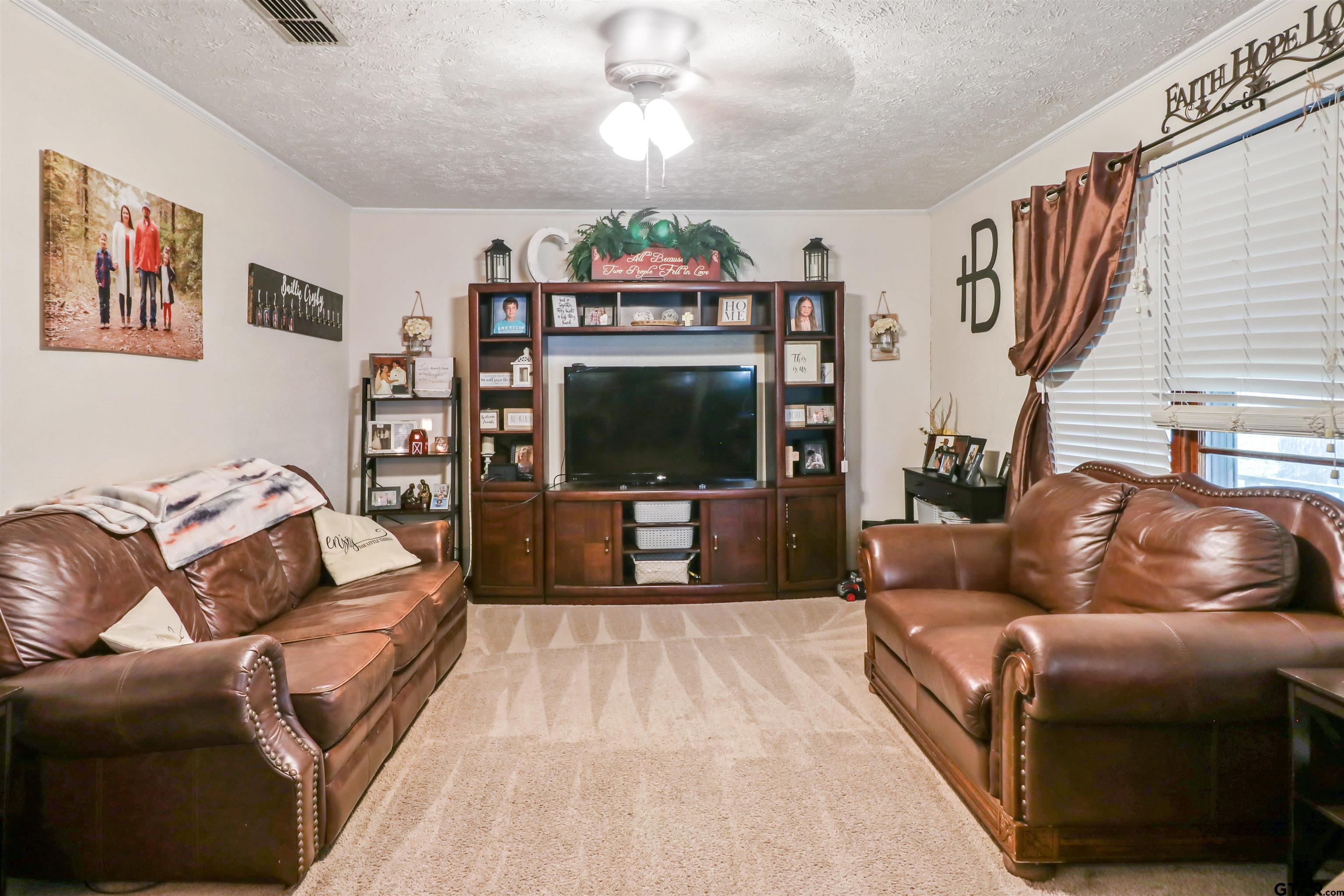 1499 Farm To Market 23 Rusk, TX 75785 - Photo 5 of 15 a living room with furniture and a flat screen tv