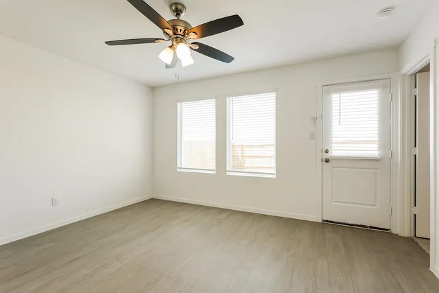 a view of an empty room with a window