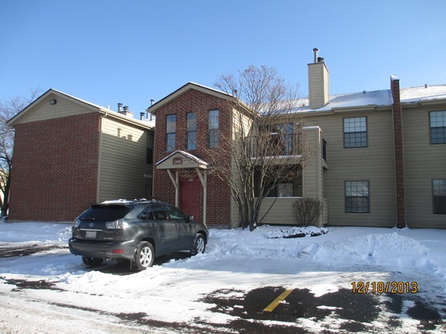 1901 North Hicks Road, Unit 103 Palatine, IL 60074 - Photo 1 of 7 a front view of a house