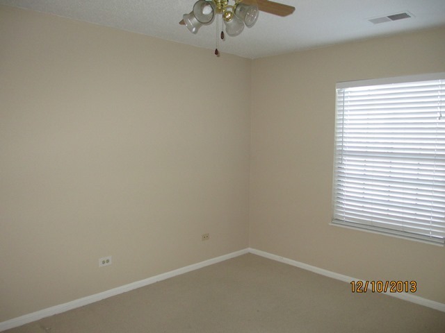 1901 North Hicks Road, Unit 103 Palatine, IL 60074 - Photo 5 of 7 an empty room with a window