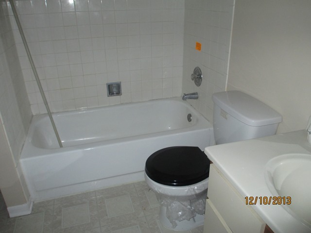 1901 North Hicks Road, Unit 103 Palatine, IL 60074 - Photo 6 of 7 a bathroom with a bathtub and a shower