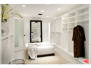 2000 Old Ranch Road Los Angeles, CA 90049 - Photo 14 of 30 a bedroom with a bed and a walk in closet