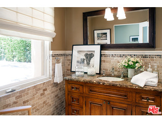 2000 Old Ranch Road Los Angeles, CA 90049 - Photo 20 of 30 a view of kitchen with granite countertop cabinets and a fireplace