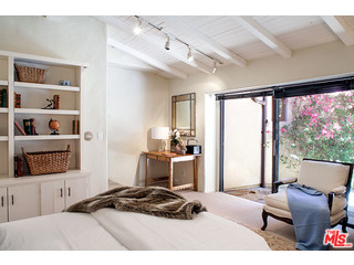 2000 Old Ranch Road Los Angeles, CA 90049 - Photo 21 of 30 a bedroom with furniture and a large window