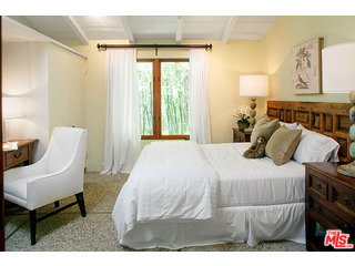 2000 Old Ranch Road Los Angeles, CA 90049 - Photo 22 of 30 a bedroom with a bed and a chair
