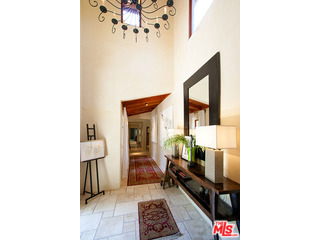 2000 Old Ranch Road Los Angeles, CA 90049 - Photo 5 of 30 a living room with furniture and a mirror