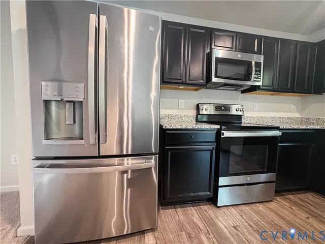 a view of a swimming pool with a outdoor seating and plants