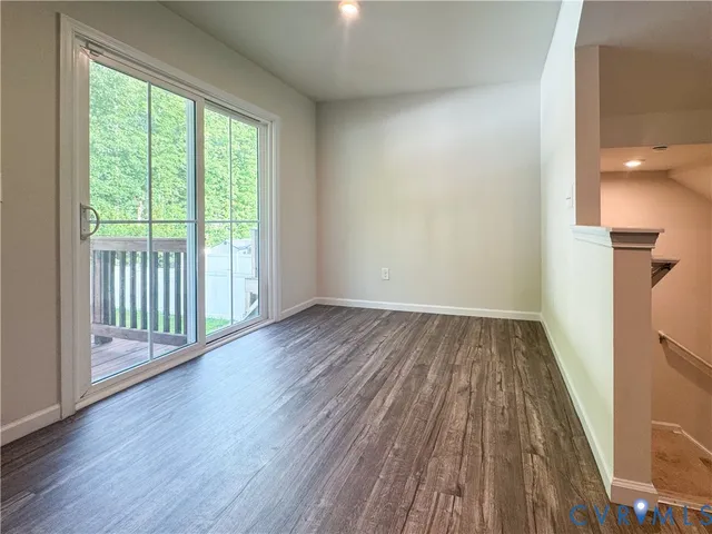 a view of a house with backyard and deck