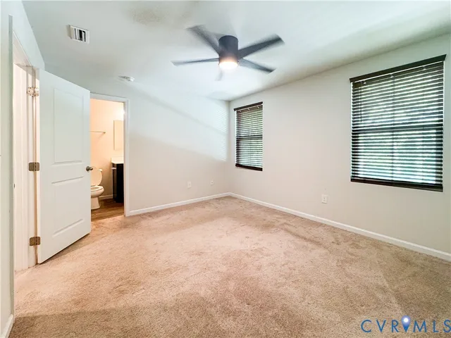 a bathroom with a sink toilet and mirror