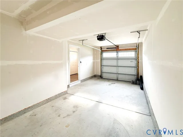 a view of an empty room with windows