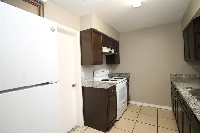 a kitchen with a stove and a microwave