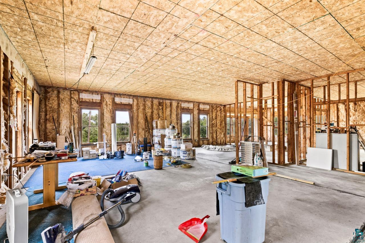 4800 Tower Road Moose Lake, MN 55767 - Photo 67 of 83 Interior space showcasing framed walls, multiple windows, and a concrete floor