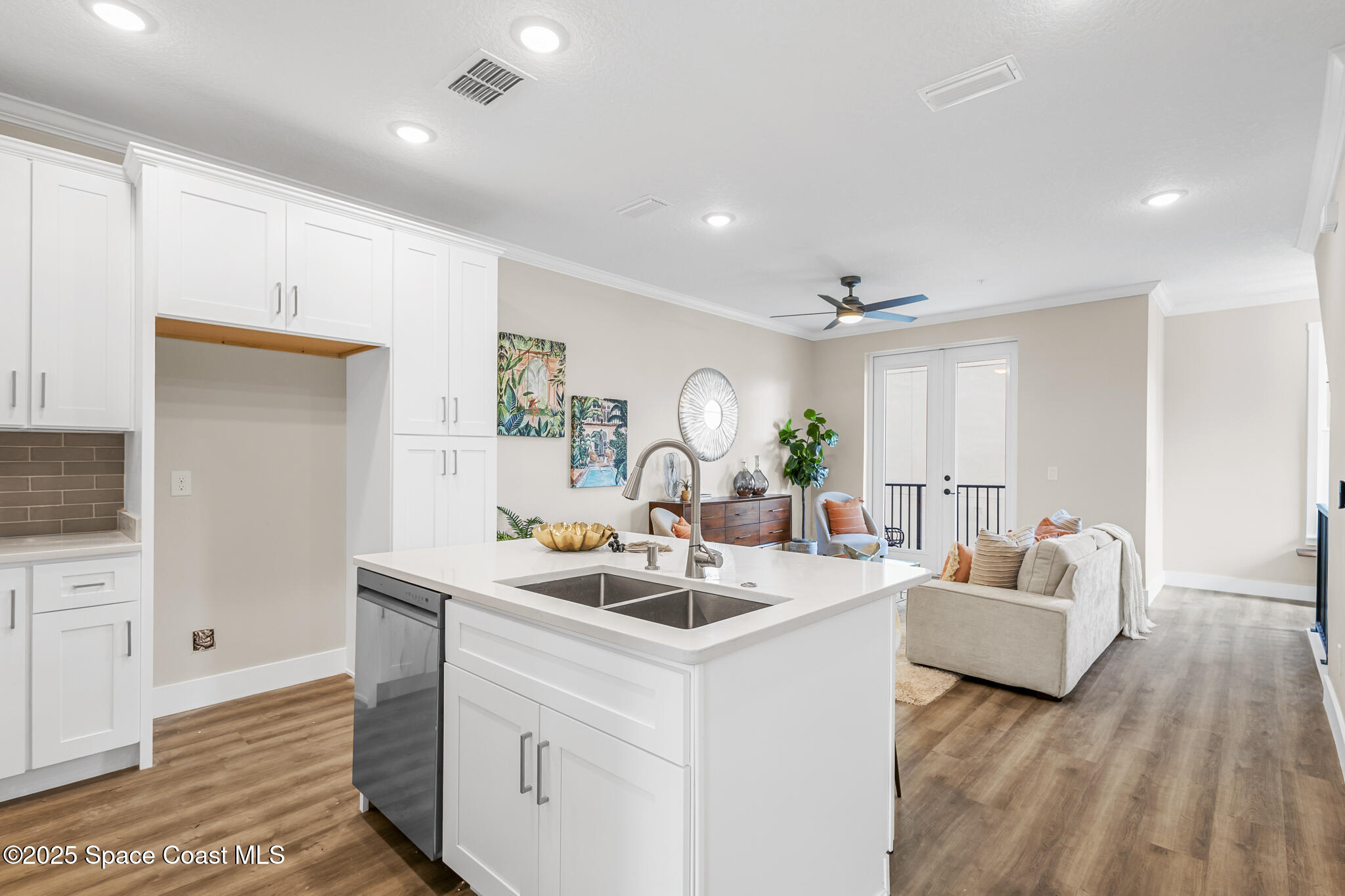 840 Florida Avenue, Unit 5 Cocoa, FL 32922 - Photo 17 of 31 a living room with furniture and a wooden floor
