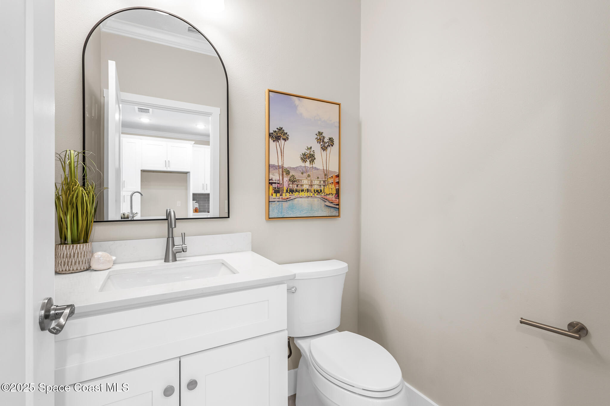 840 Florida Avenue, Unit 5 Cocoa, FL 32922 - Photo 19 of 31 a bathroom with a sink mirror vanity and toilet