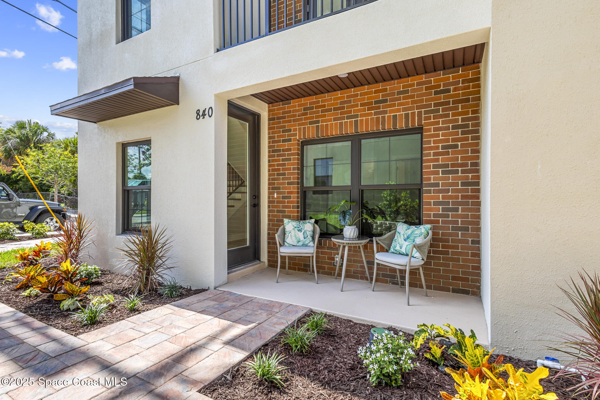 840 Florida Avenue, Unit 5 Cocoa, FL 32922 - Photo 2 of 31 a view of a patio with table and chairs and potted plants