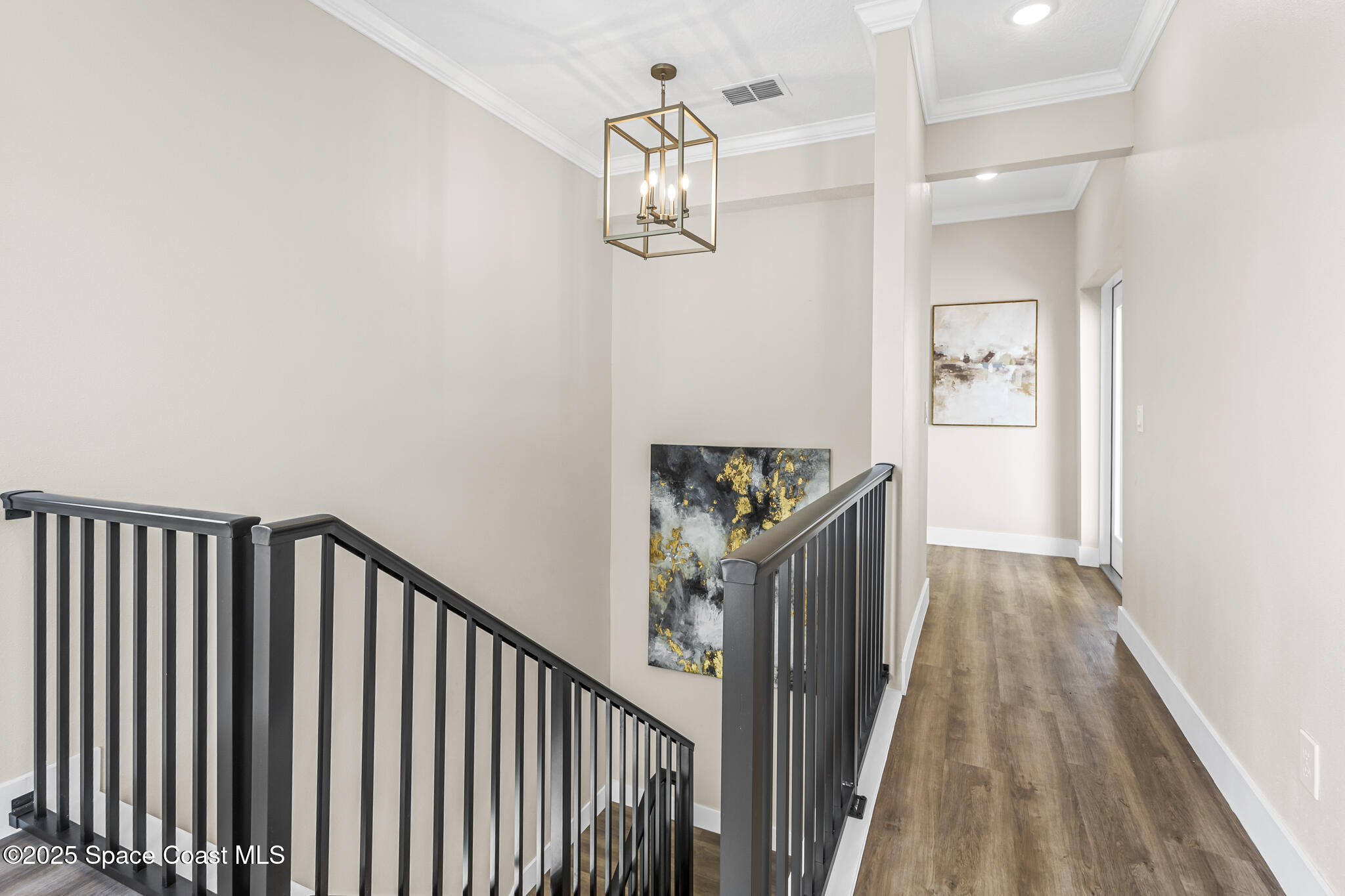 840 Florida Avenue, Unit 5 Cocoa, FL 32922 - Photo 25 of 31 a view of a hallway with wooden floor