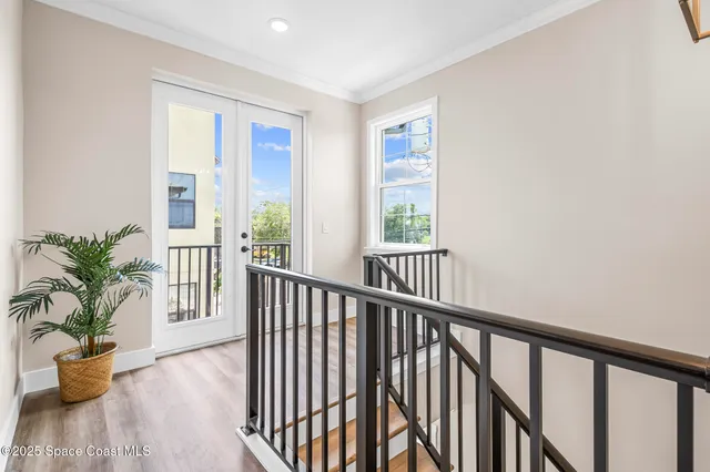 a view of a porch with a table and chairs