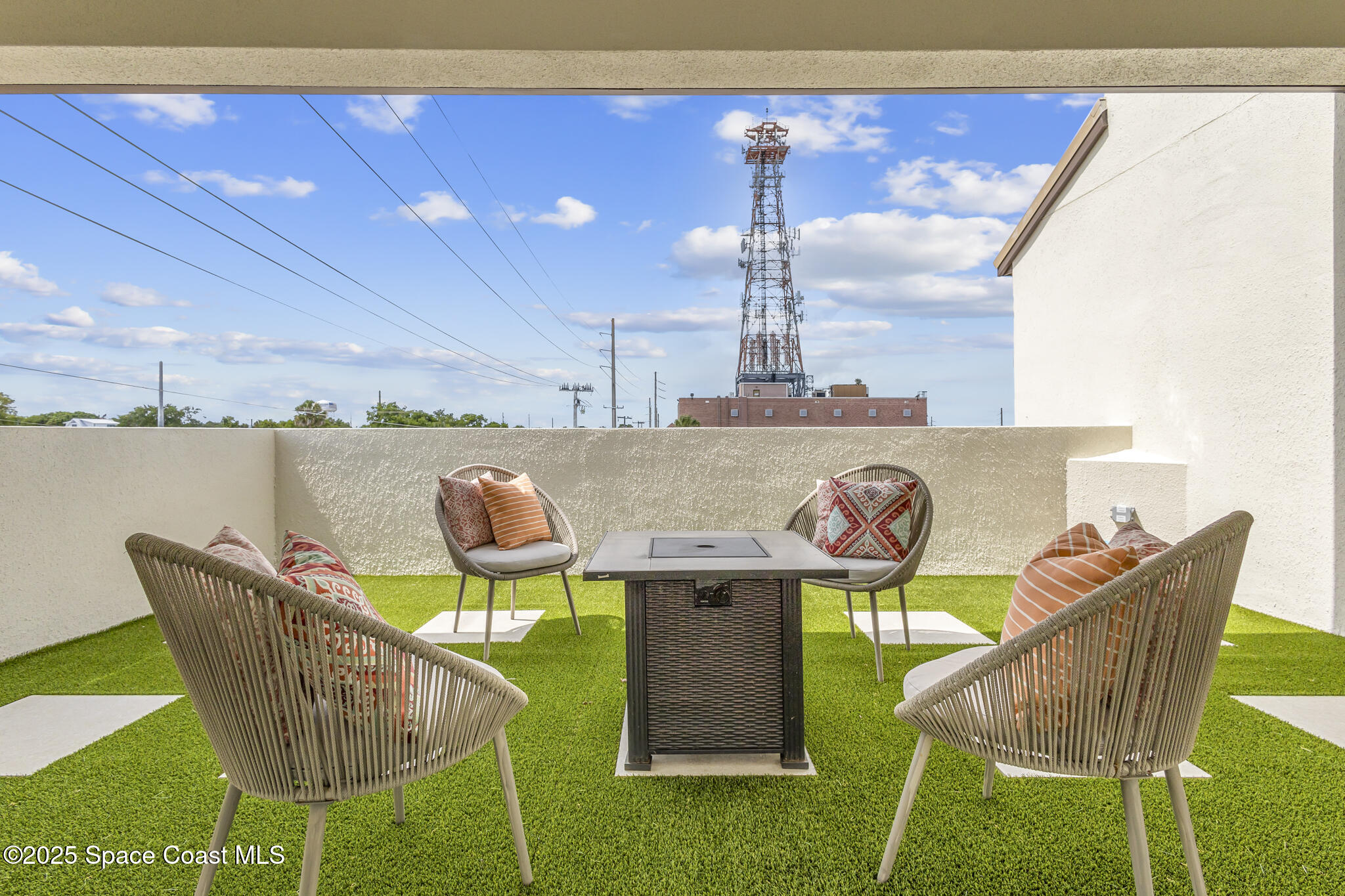 840 Florida Avenue, Unit 5 Cocoa, FL 32922 - Photo 29 of 31 a view of a chairs and table in the patio
