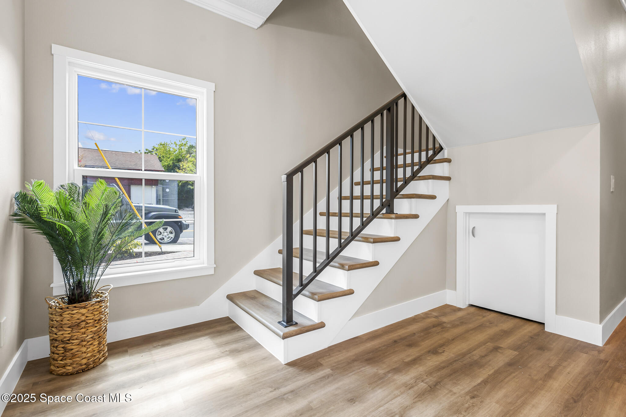 840 Florida Avenue, Unit 5 Cocoa, FL 32922 - Photo 4 of 31 a view of entryway with wooden floor and a potted plant