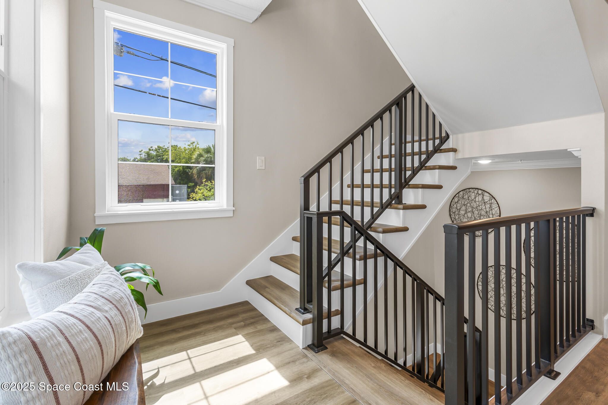 840 Florida Avenue, Unit 5 Cocoa, FL 32922 - Photo 10 of 31 a living room with furniture and stairs