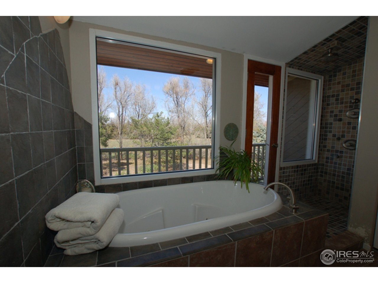 10080 Phillips Road Lafayette, CO 80026 - Photo 17 of 24 a view of furniture and window in a room