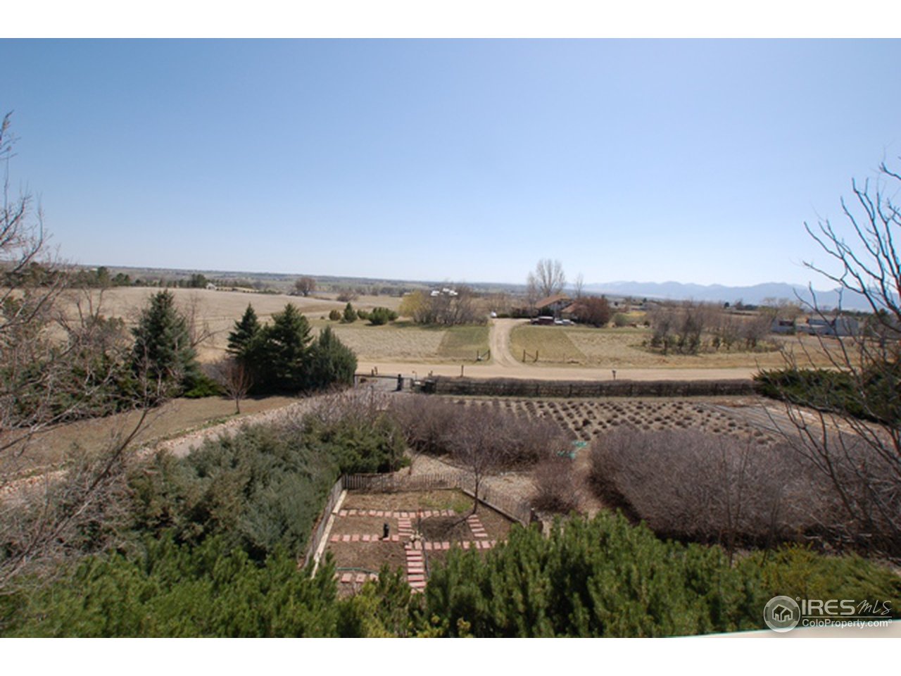 10080 Phillips Road Lafayette, CO 80026 - Photo 4 of 24 a view of a lake with houses in the back