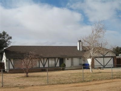 10710 Tecopa Road Apple Valley, CA 92308 - Photo 1 of 1 a front view of a house
